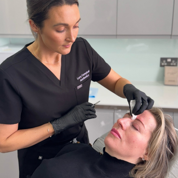 Lucy performing anti wrinkle treatment